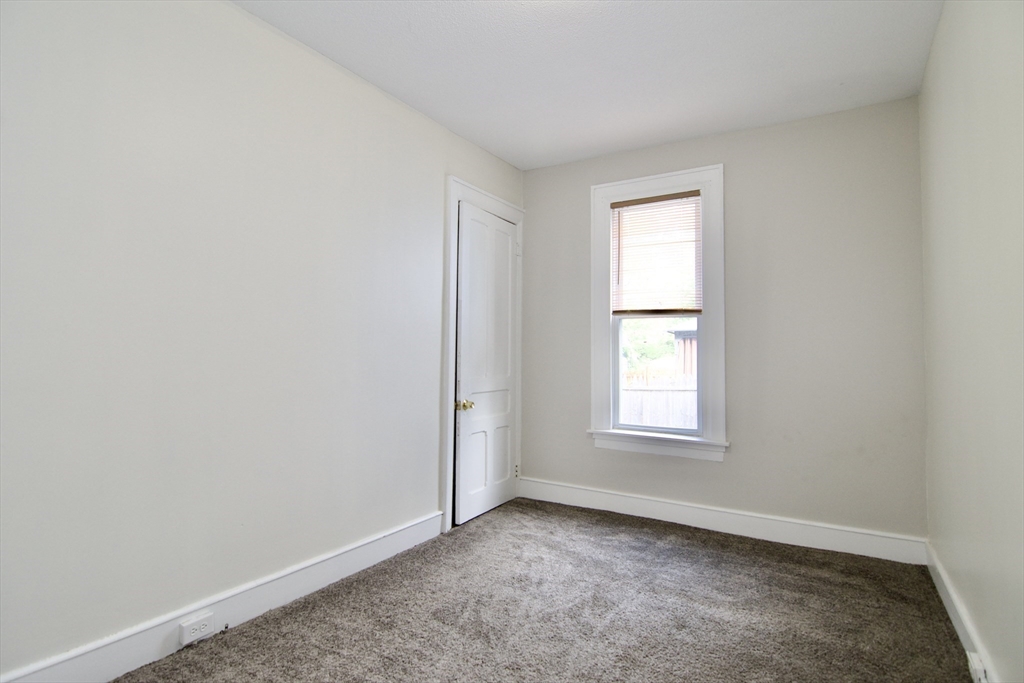 58 Howes Street, Unit 1 Springfield, MA 01118 - Photo 19 of 24 an empty room with a window