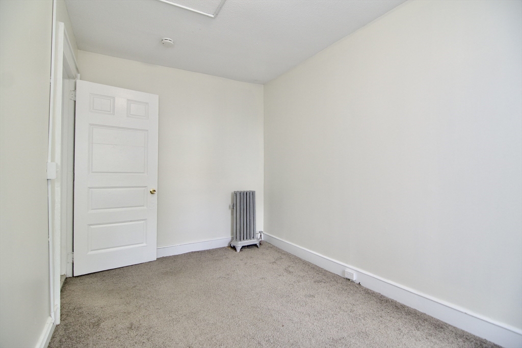 58 Howes Street, Unit 1 Springfield, MA 01118 - Photo 21 of 24 an empty room with closet