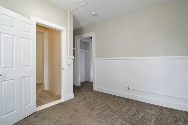 a kitchen with stainless steel appliances granite countertop a sink cabinets and wooden floor