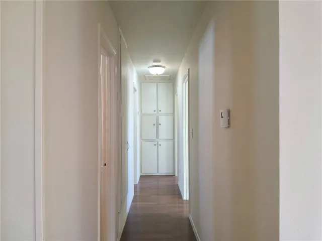 a view of a hallway with an entryway