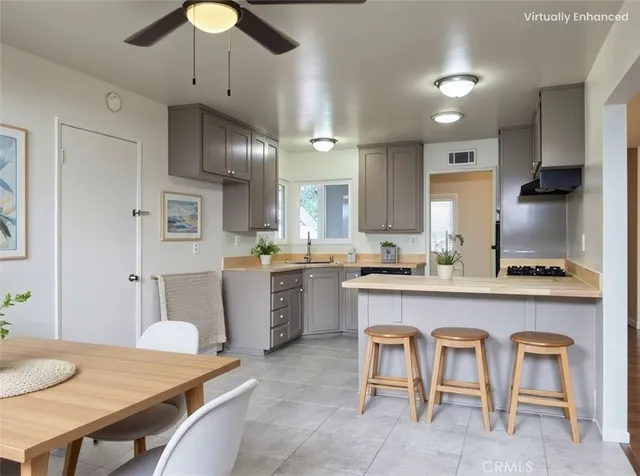 a kitchen with sink cabinets and wooden floor
