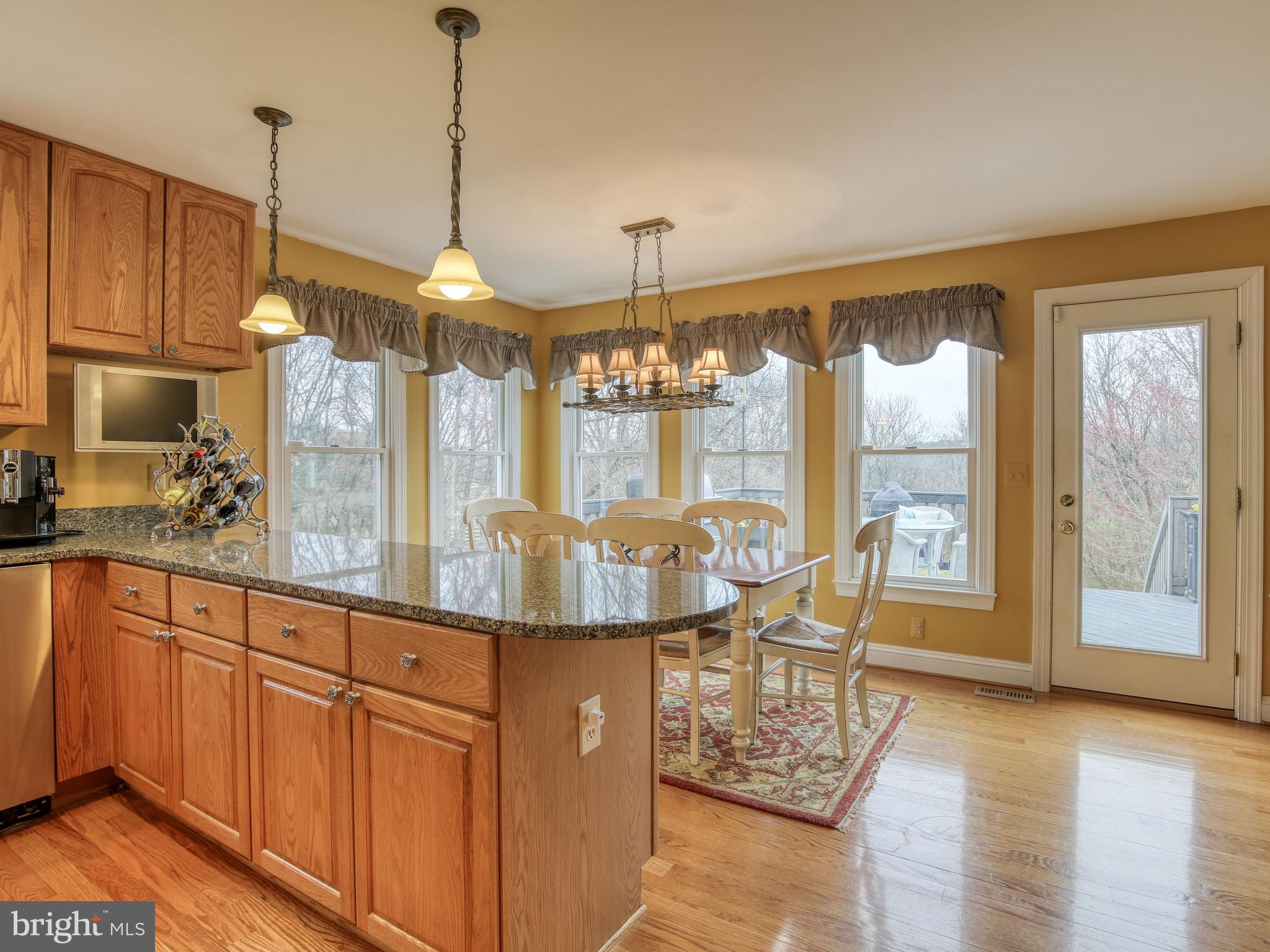 249 McGuire Road Winchester, VA 22603 - Photo 25 of 54 Open breakfast room that walks out onto deck
