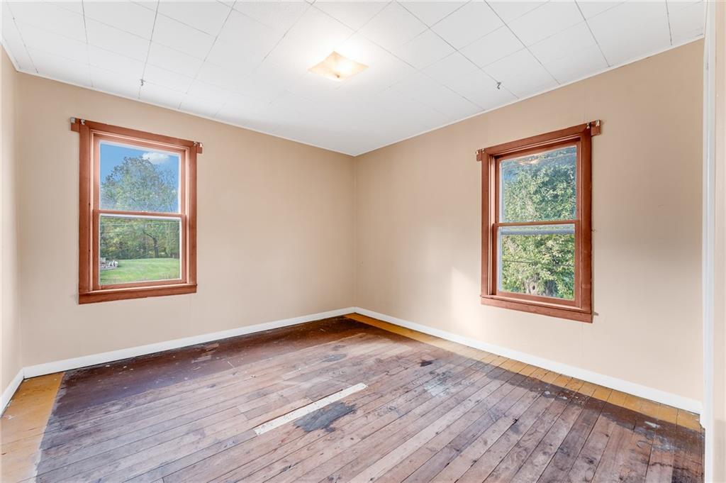 114 Post Road Dilliner, PA 15327 - Photo 26 of 50 an empty room with wooden floor and windows