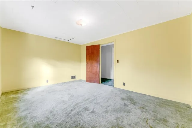 a kitchen with stainless steel appliances granite countertop a stove a sink and a refrigerator with wooden floor