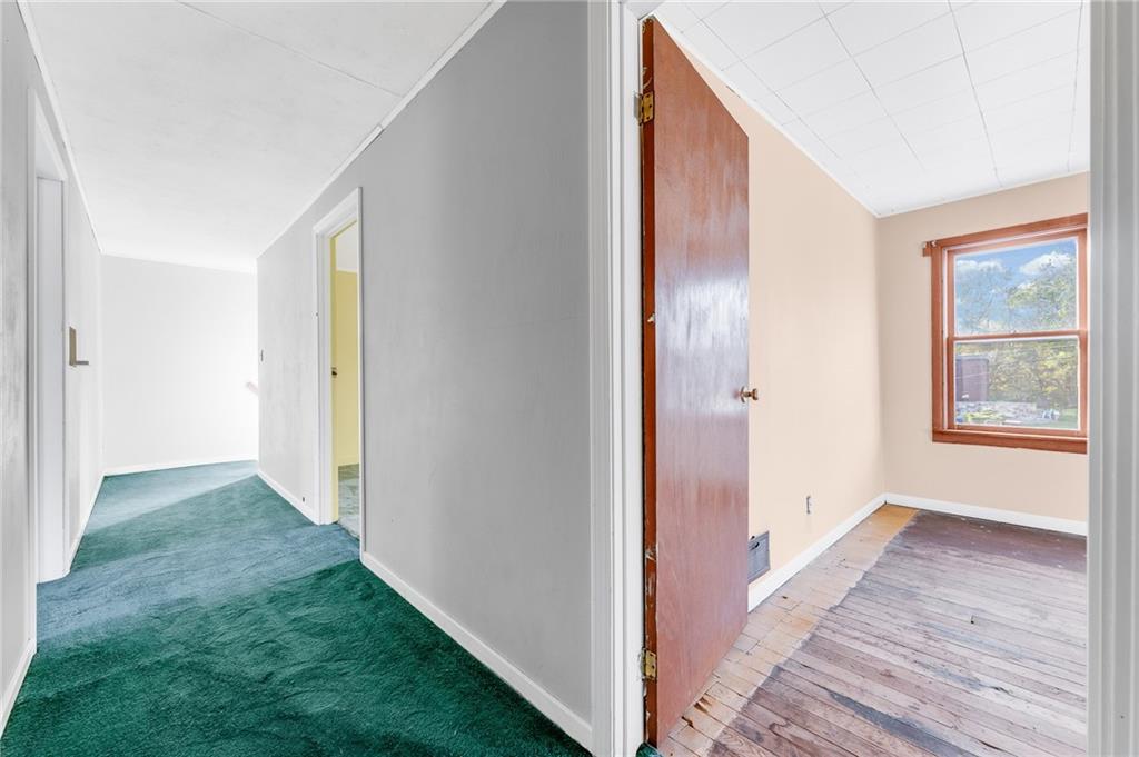 114 Post Road Dilliner, PA 15327 - Photo 33 of 50 a view of a hallway with wooden floor and cabinet