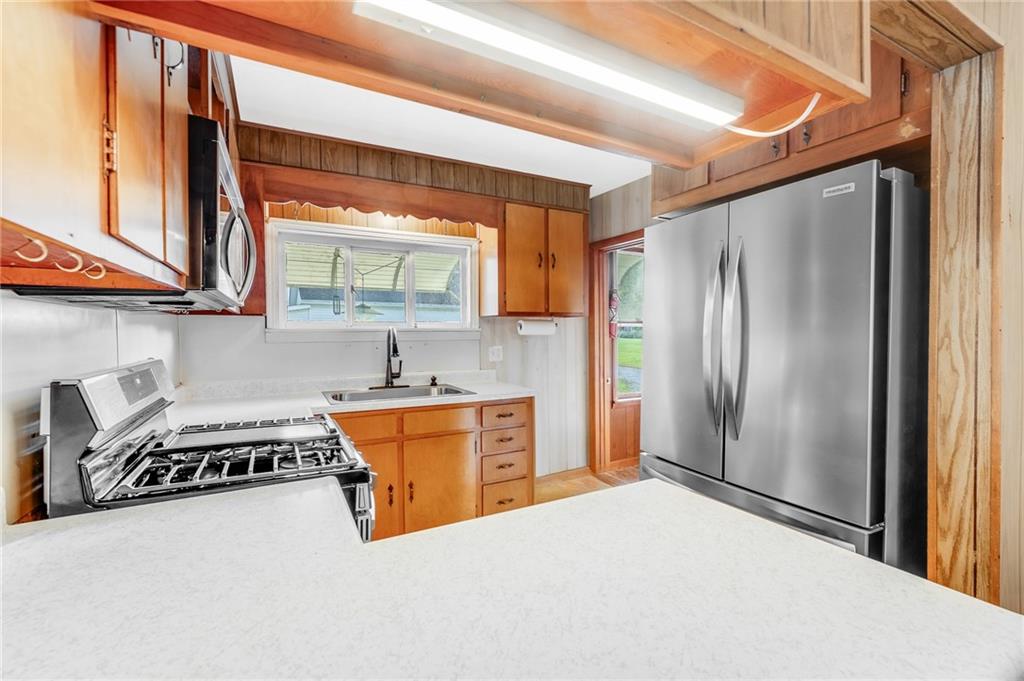114 Post Road Dilliner, PA 15327 - Photo 45 of 50 a kitchen with stainless steel appliances granite countertop a refrigerator and a stove