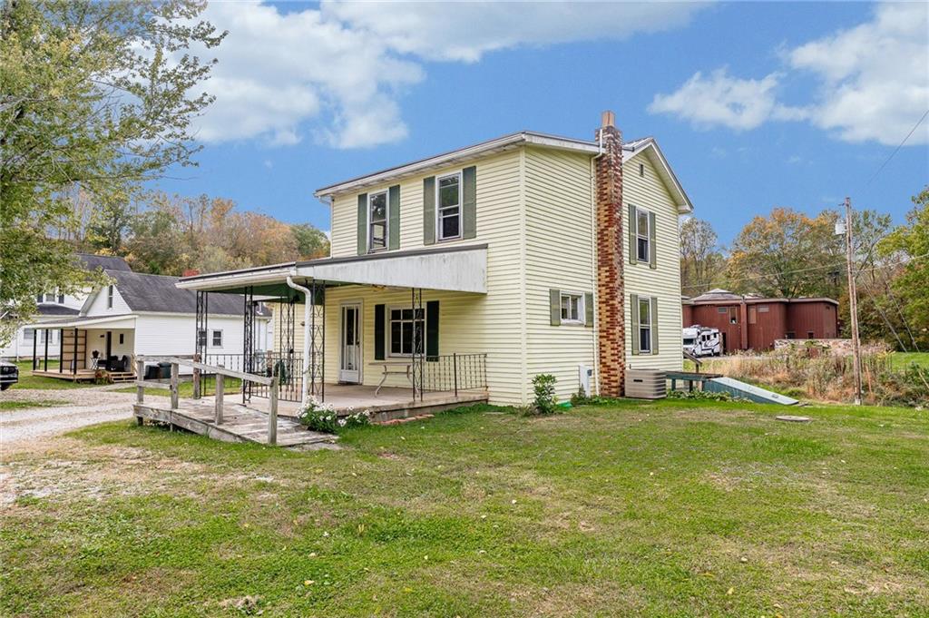 114 Post Road Dilliner, PA 15327 - Photo 5 of 50 a view of a house with a yard