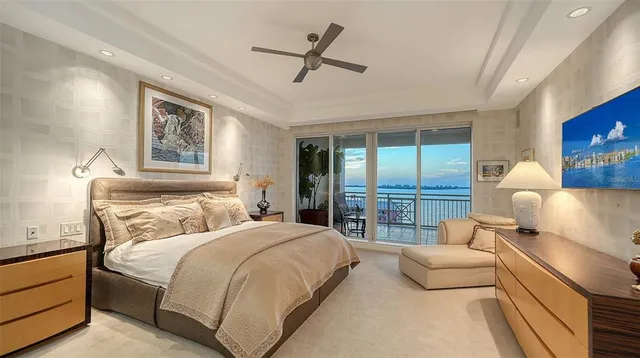 a bedroom with a large bed and a large window