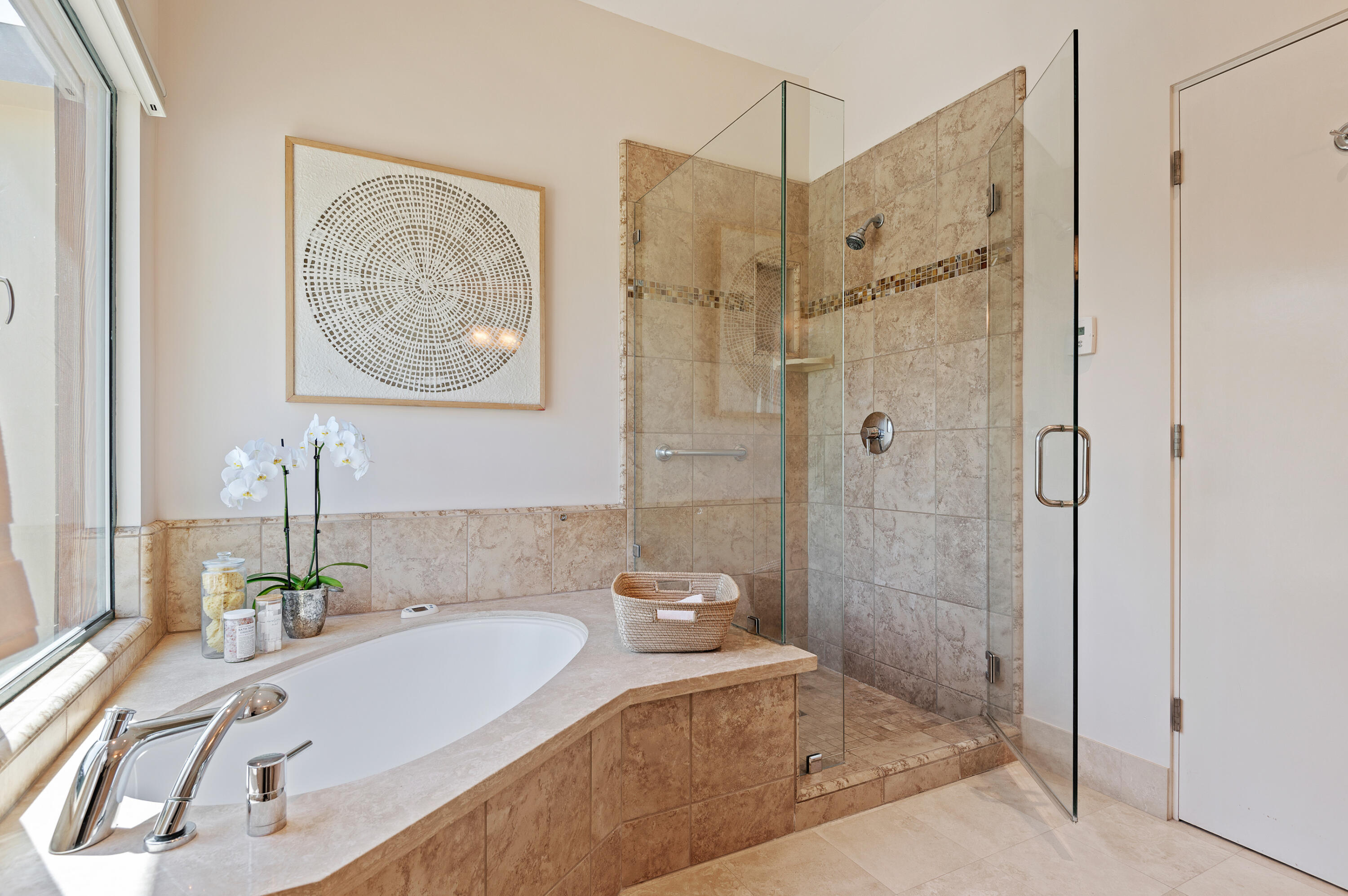 4815 Sandyland Road, Unit A Carpinteria, CA 93013 - Photo 16 of 29 a bathroom with a tub a sink and glass door shower