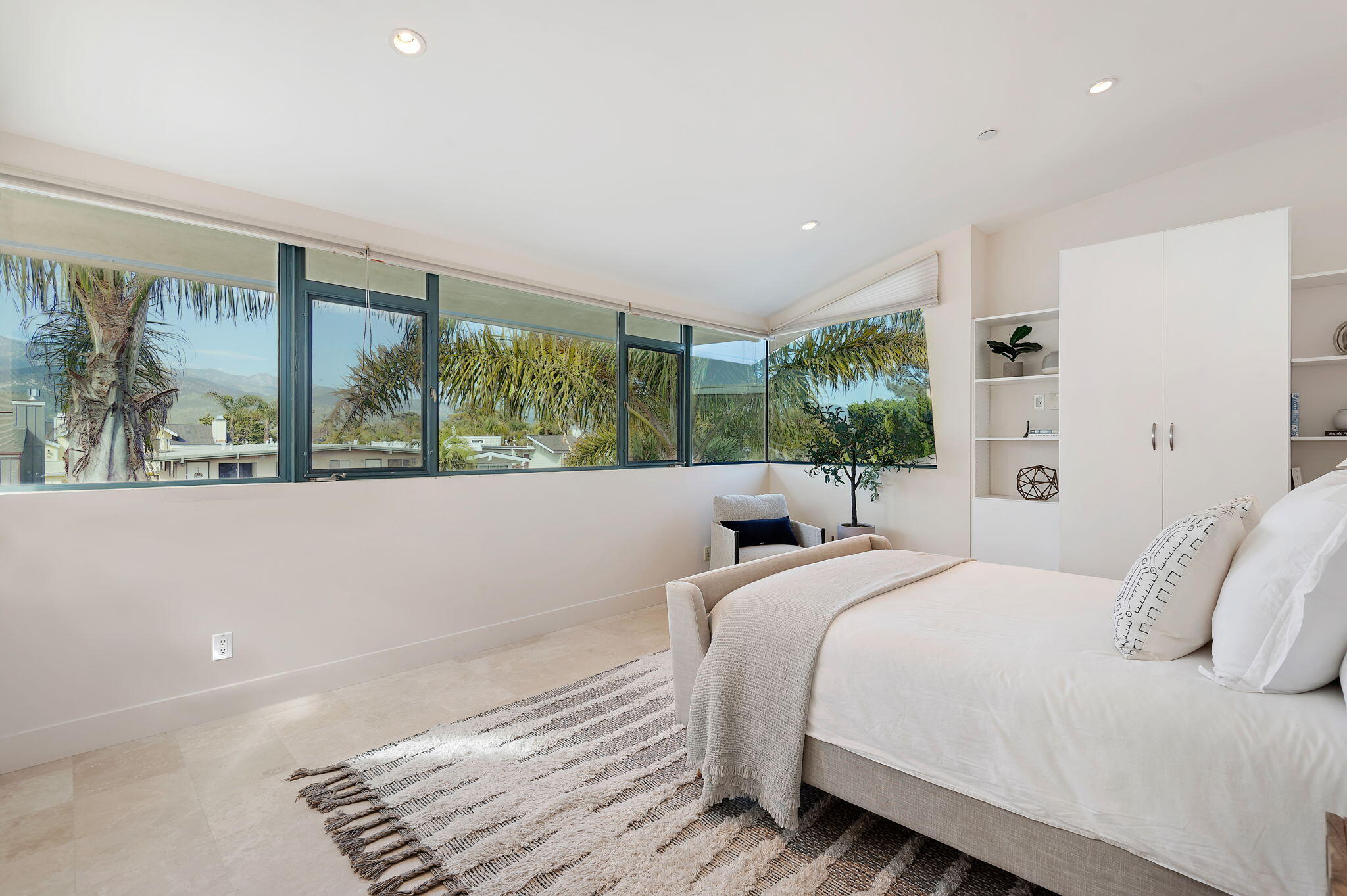 4815 Sandyland Road, Unit A Carpinteria, CA 93013 - Photo 22 of 29 a bedroom with a large bed and a large window