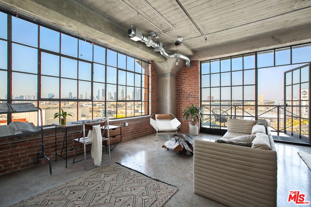 691 Mill Street, Unit 705 Los Angeles, CA 90021 - Photo 2 of 11 a living room with furniture and a large window