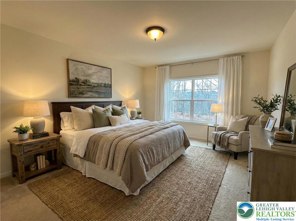 106 Hilda Court East Stroudsburg, PA 18301 - Photo 12 of 33 a spacious bedroom with a bed and large windows