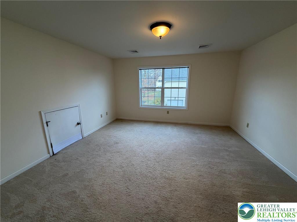 106 Hilda Court East Stroudsburg, PA 18301 - Photo 13 of 33 an empty room with windows