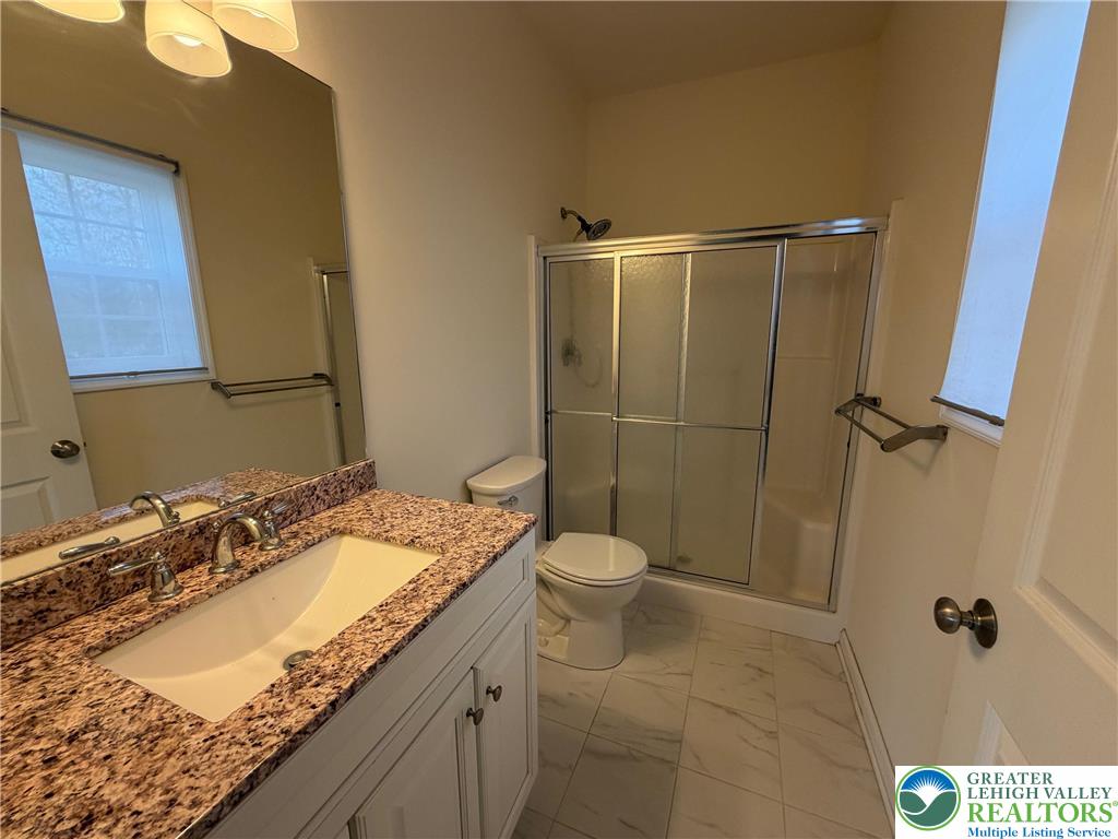106 Hilda Court East Stroudsburg, PA 18301 - Photo 17 of 33 a bathroom with a granite countertop sink toilet and shower