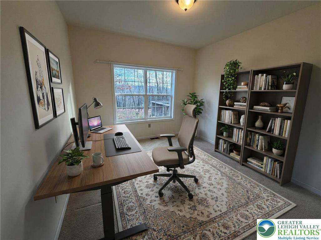 106 Hilda Court East Stroudsburg, PA 18301 - Photo 18 of 33 a view of a workspace with furniture and a bookshelf