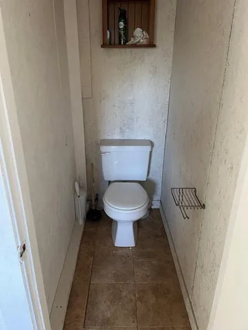 a bathroom with a toilet