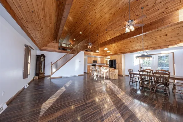 a dining room with furniture wooden floor and chandelier
