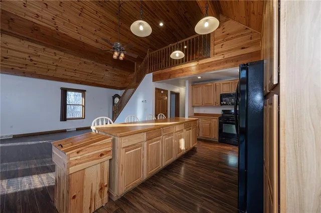 a kitchen with stainless steel appliances granite countertop a sink and cabinets