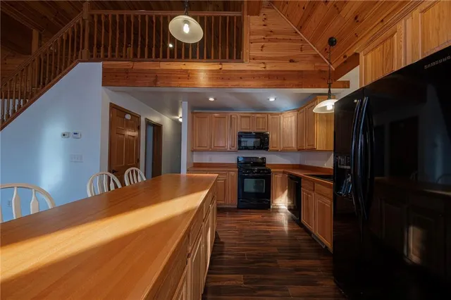 a kitchen with counter top space and appliances