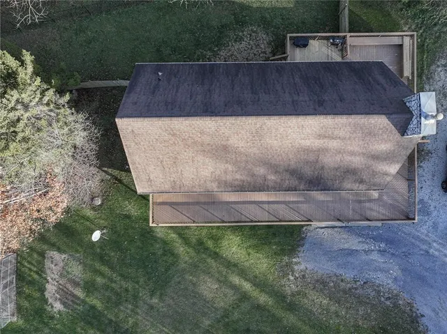 a view of a swimming pool with a yard