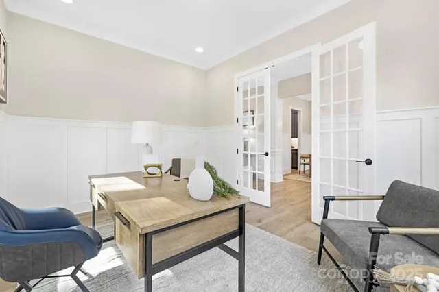 a view of a livingroom with furniture and lounge chair