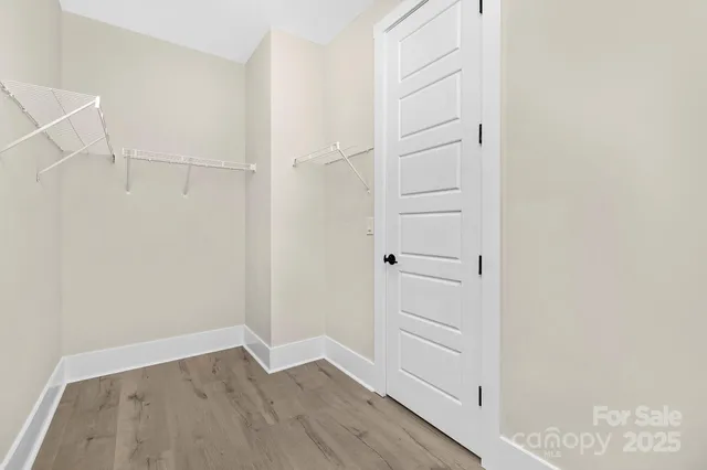 a view of an empty walk in closet