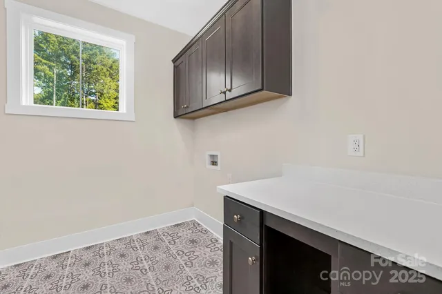a room with a sink and cabinets