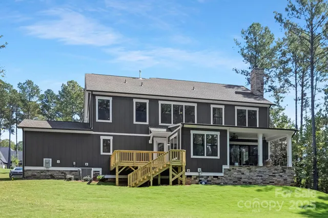 a front view of house with yard and outdoor seating