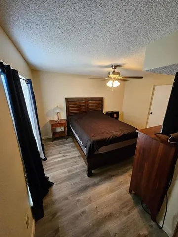 a bedroom with bed and window