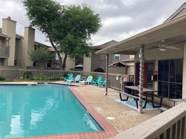 a view of a swimming pool with chairs