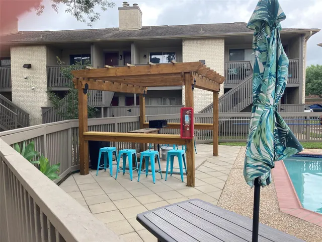a view of house with outdoor seating