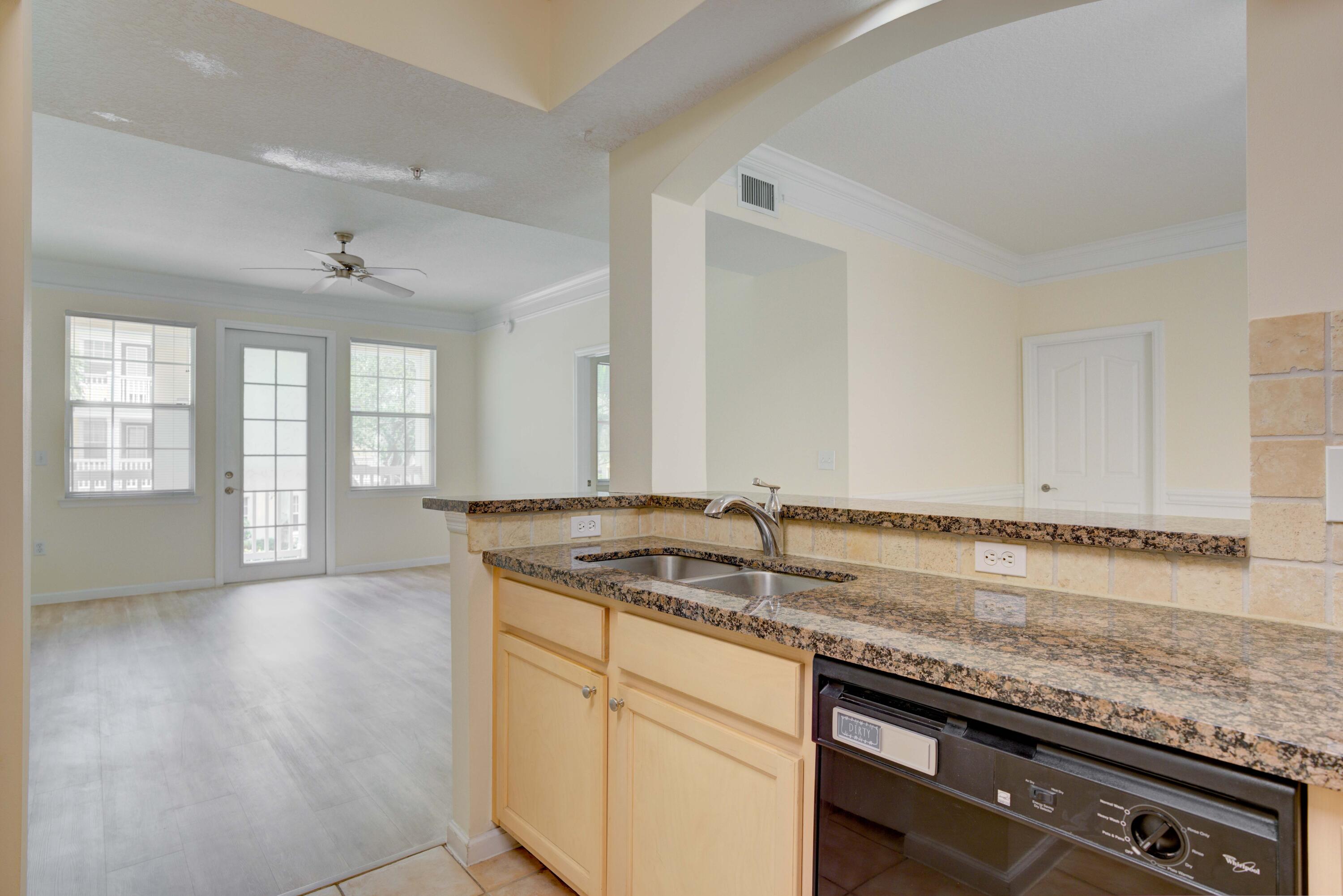 224 Murcia Drive, Unit 201 Jupiter, FL 33458 - Photo 16 of 36 a bathroom with a granite countertop sink and a window