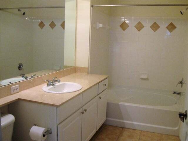 224 Murcia Drive, Unit 201 Jupiter, FL 33458 - Photo 20 of 36 a bathroom with a sink and a mirror