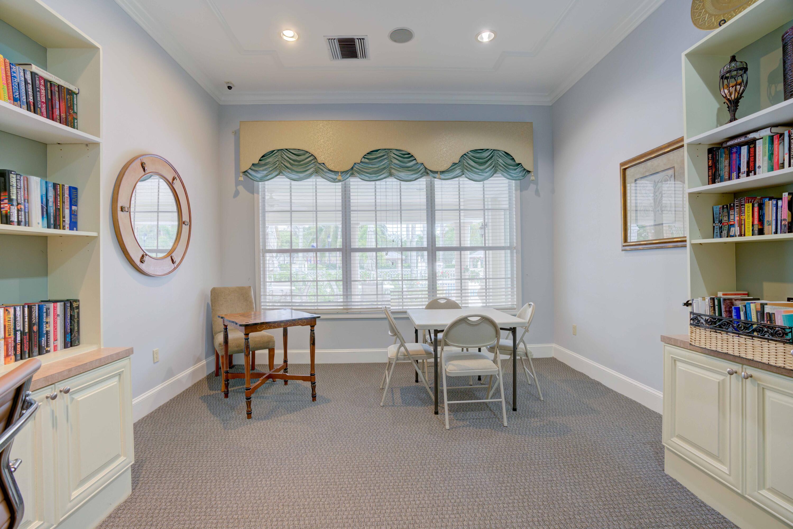 224 Murcia Drive, Unit 201 Jupiter, FL 33458 - Photo 28 of 36 a view of a livingroom with workspace and a window