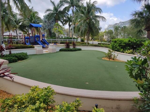 224 Murcia Drive, Unit 201 Jupiter, FL 33458 - Photo 31 of 36 an outdoor space with lots of palm trees