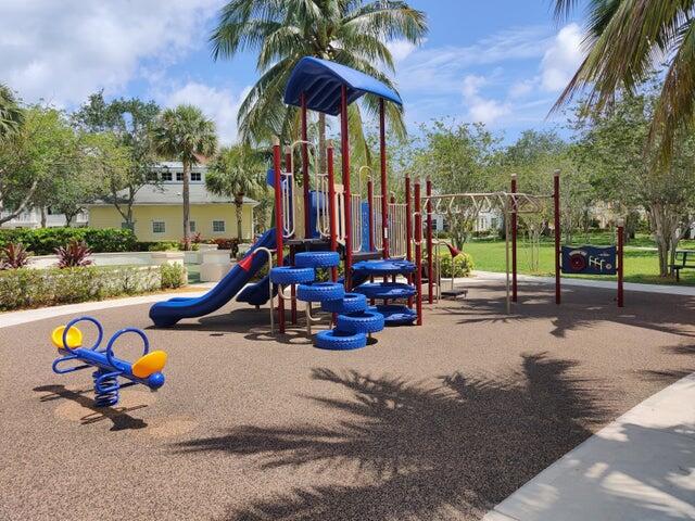 224 Murcia Drive, Unit 201 Jupiter, FL 33458 - Photo 35 of 36 a view of a park with swings and slides