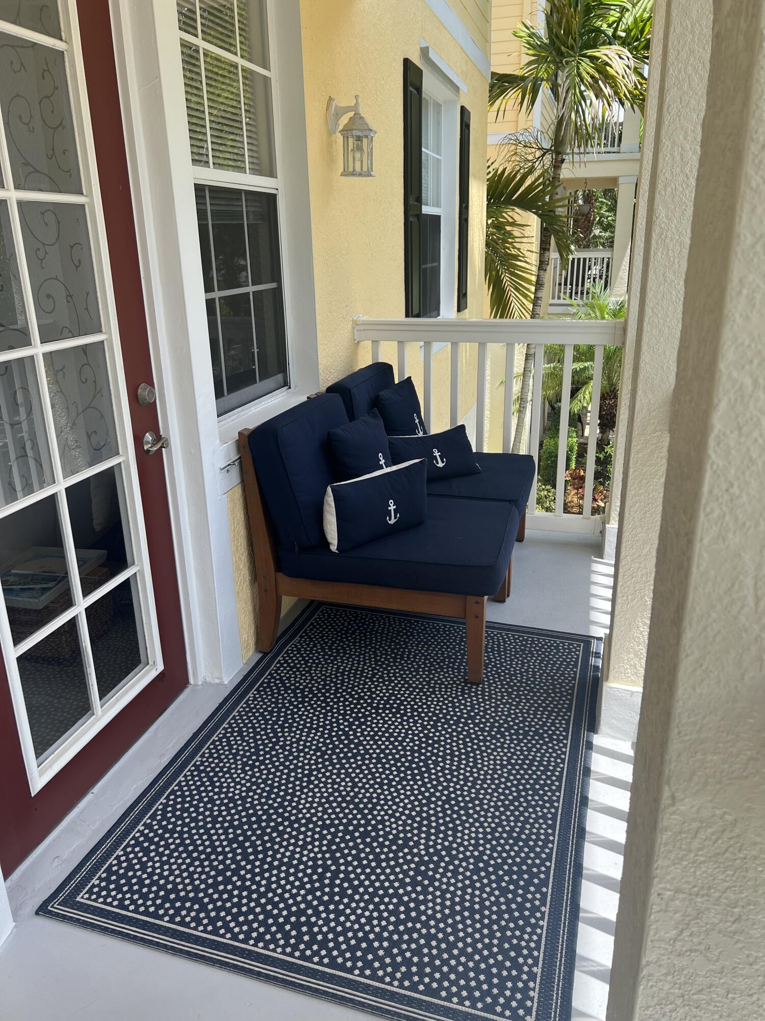 224 Murcia Drive, Unit 201 Jupiter, FL 33458 - Photo 7 of 36 a living room with furniture and a window