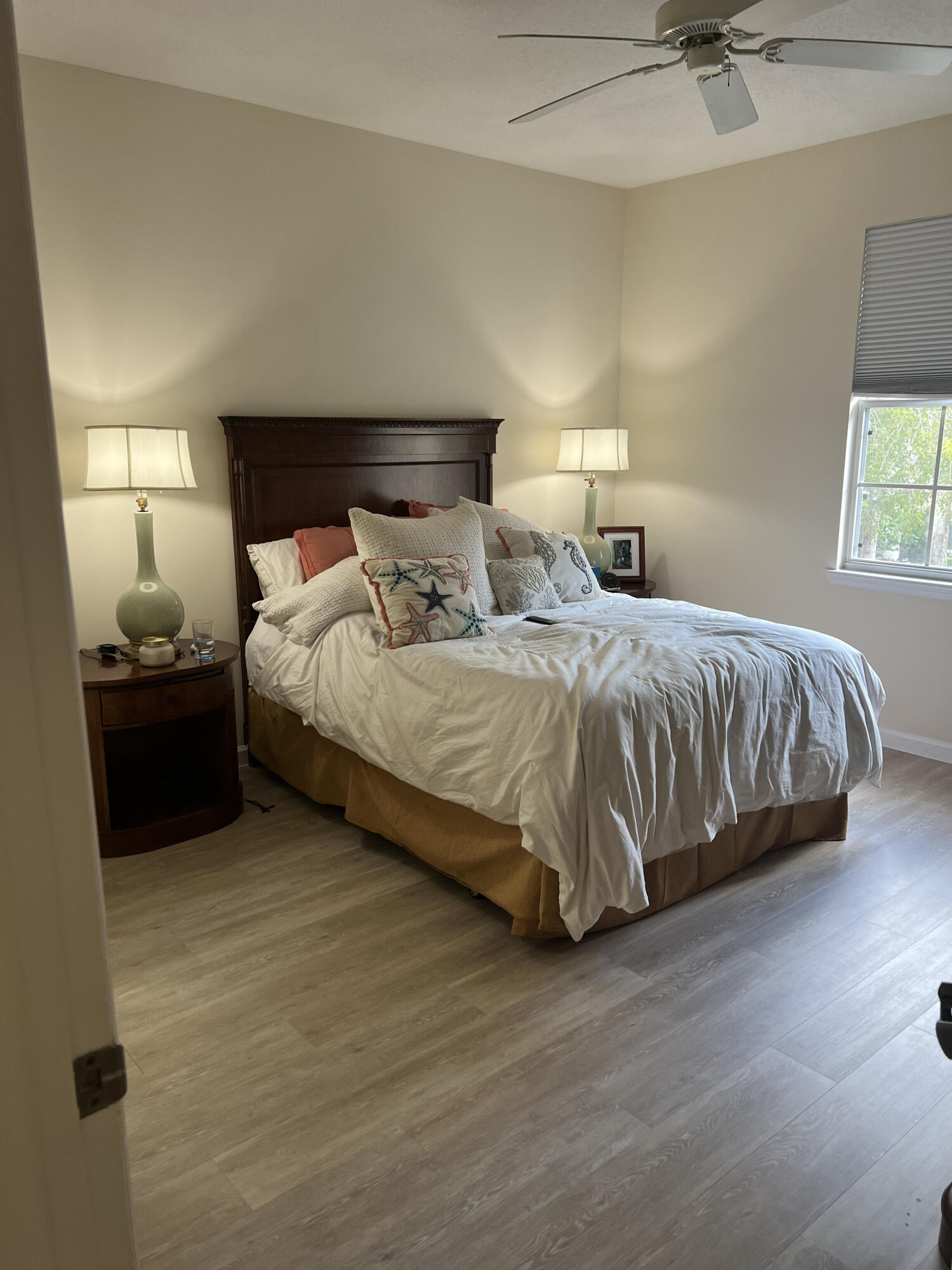 224 Murcia Drive, Unit 201 Jupiter, FL 33458 - Photo 8 of 36 a bedroom with double bed and a window