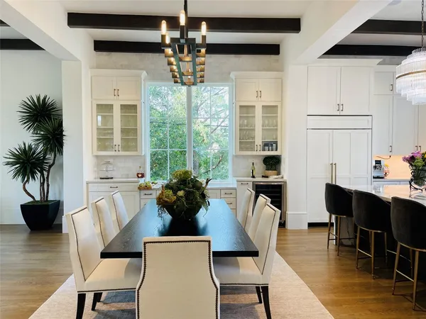 a living room with fireplace furniture and a large window