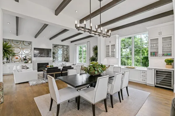 a bedroom with bed couch and window