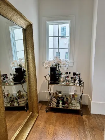 a bathroom with a tub a sink and mirrors