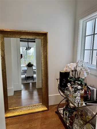 a bathroom with a double vanity sink mirror and bathtub