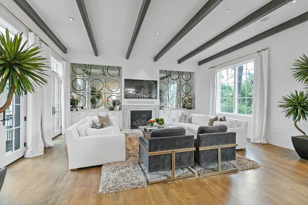 a spacious bathroom with a shower a sink and a mirror