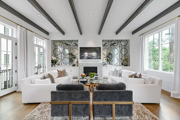 a bedroom with a dresser and a window