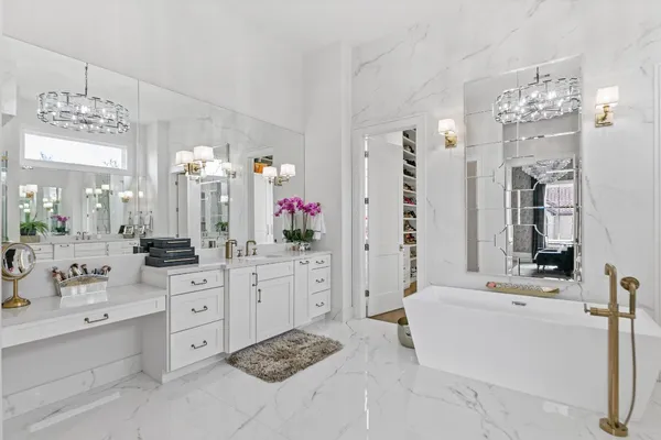 a roof deck with couches and potted plants