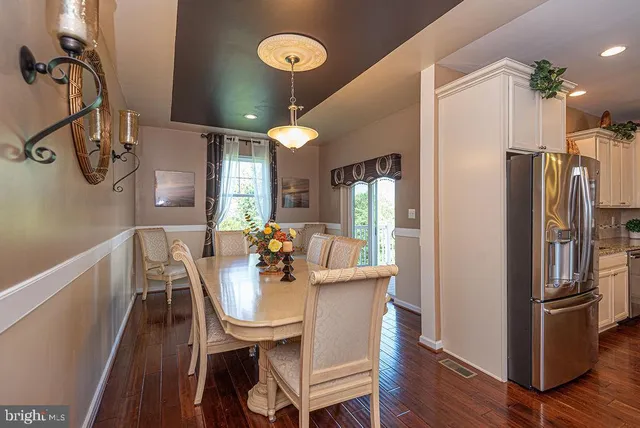 a view of entryway with wooden floor and stairs