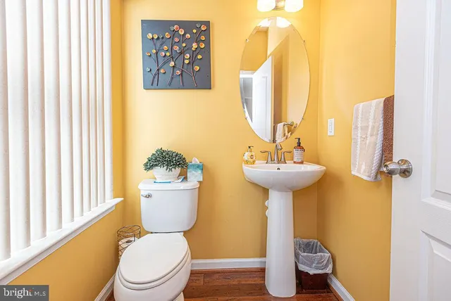 a spacious bedroom with a bed and a lamp