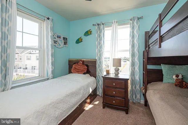 a bathroom with a sink a toilet and shower curtain