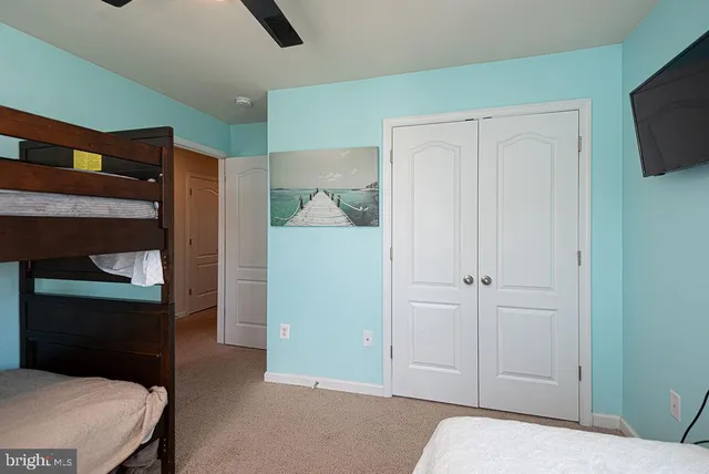 a view of a backyard with table and chairs and garden