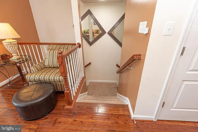 an aerial view of a house with a garden and lake view